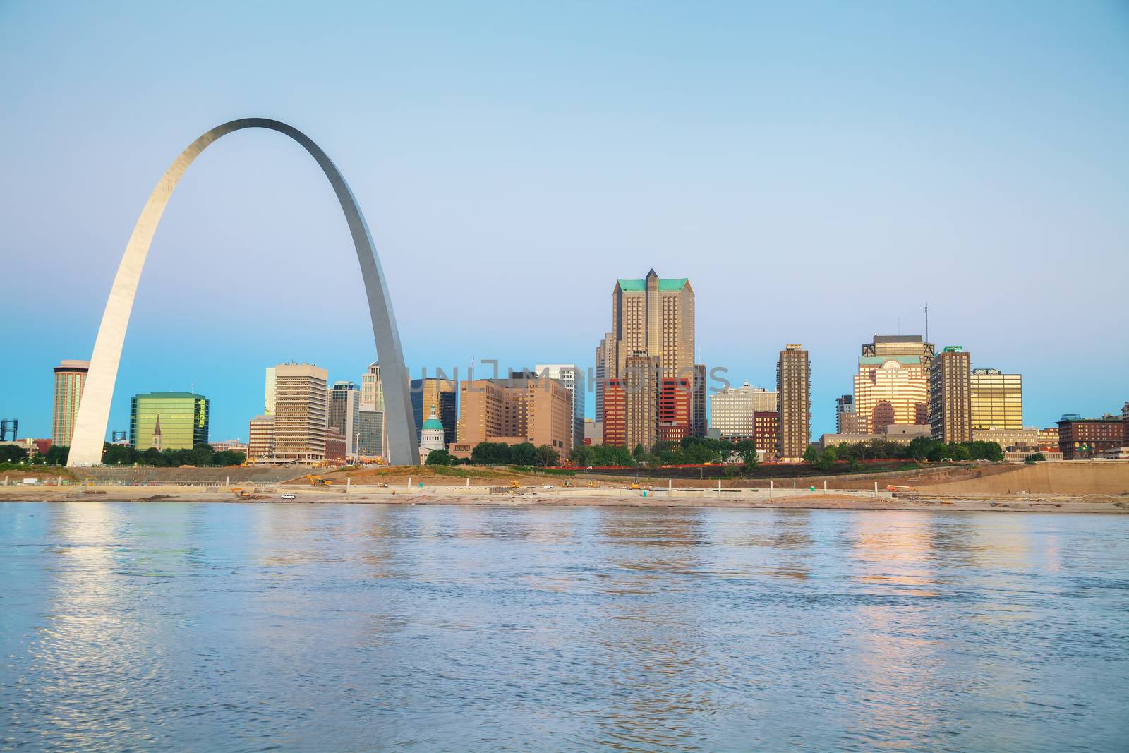 Downtown St Louis, MO with the Old Courthouse and the Gateway Arch at sunrise