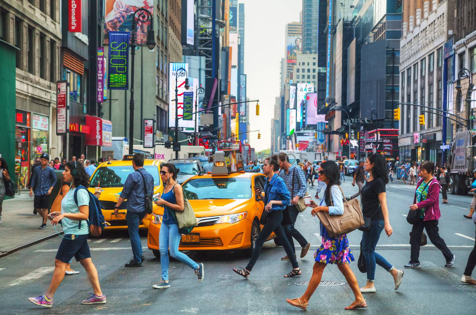 NEW YORK CITY - SEPTEMBER 4: People crossing a street on September 4, 2015 in New York. 