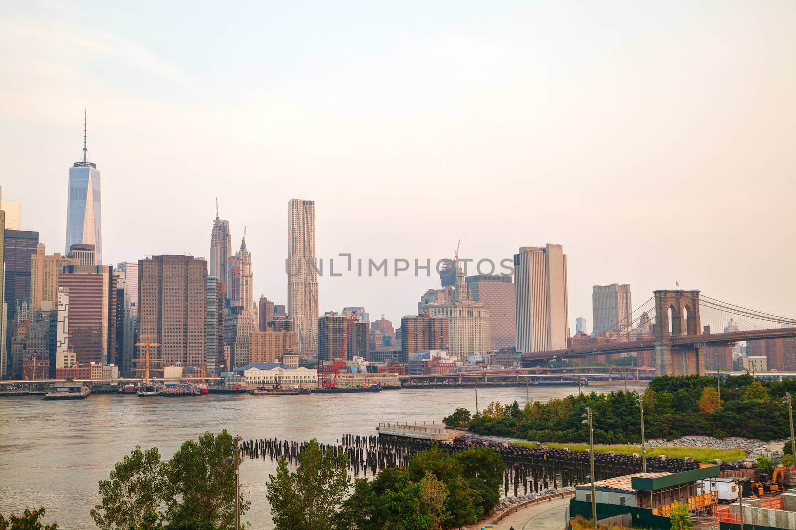 Lower Manhattan cityscape with the Brooklyn bridge by AndreyKr
