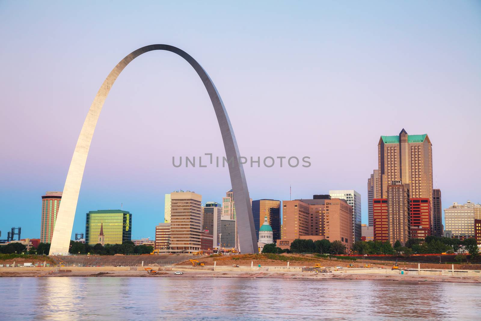 Downtown St Louis, MO with the Old Courthouse and the Gateway Arch at sunrise