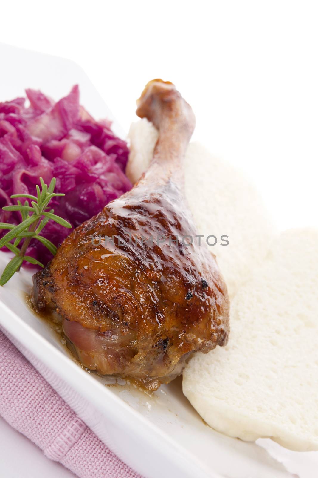 Delicious roast duck with red cabbage and dumplings. Traditional festive eating. 