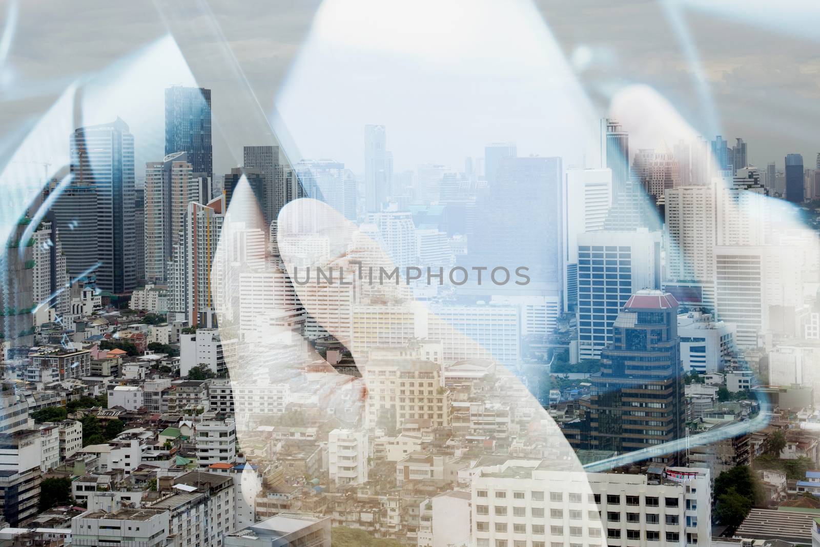 Using digital tablet double exposure and and cityscape background. communication technology concept.