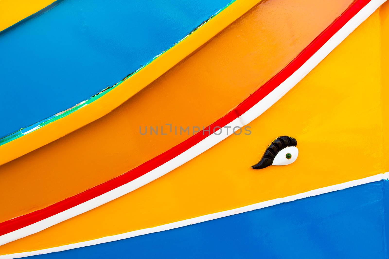 Abstract close up view of the vibrant colours and design usually used on the traditional Maltese fishing boat, the "Dghajsa" or "Luzzu".