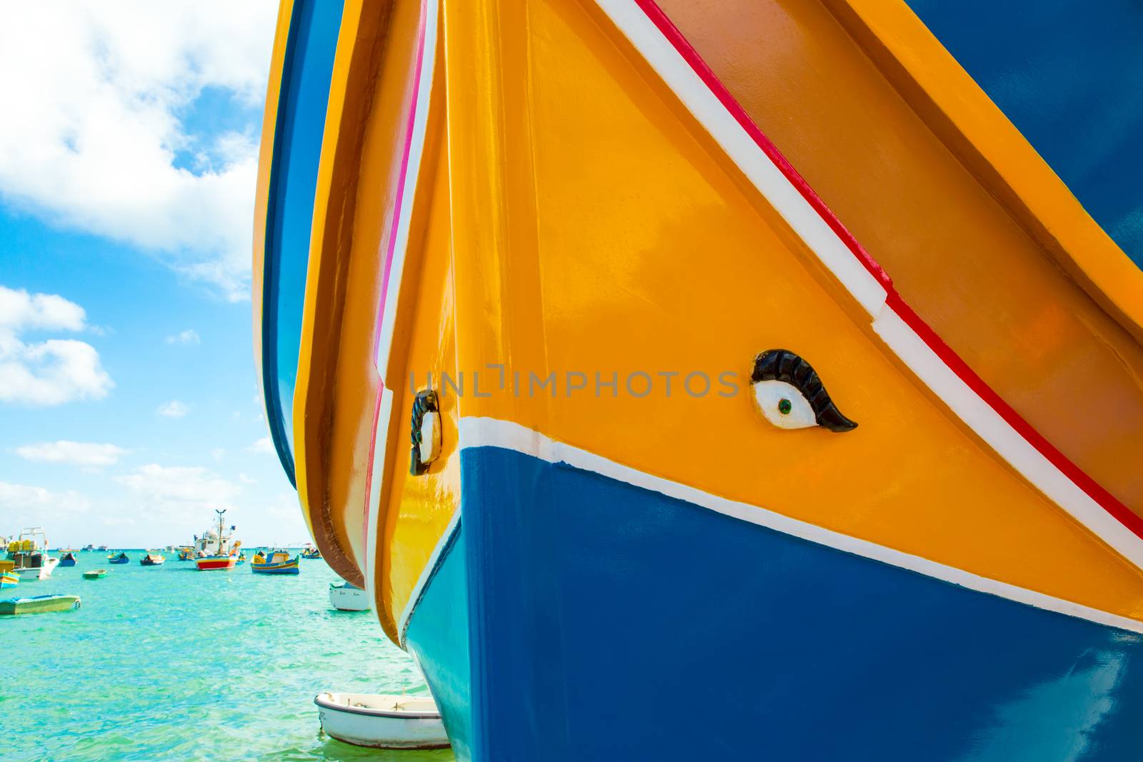 Abstract close up view of the vibrant colours and design usually used on the traditional Maltese fishing boat, the "Dghajsa" or "Luzzu".