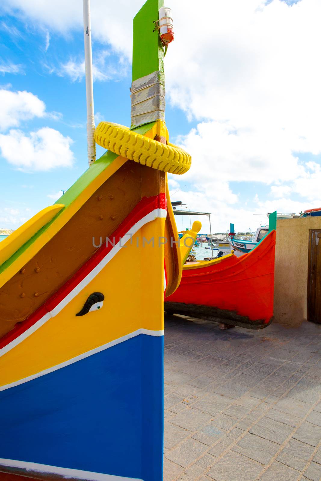 Abstract close up view of the vibrant colours and design usually used on the traditional Maltese fishing boat, the "Dghajsa" or "Luzzu".