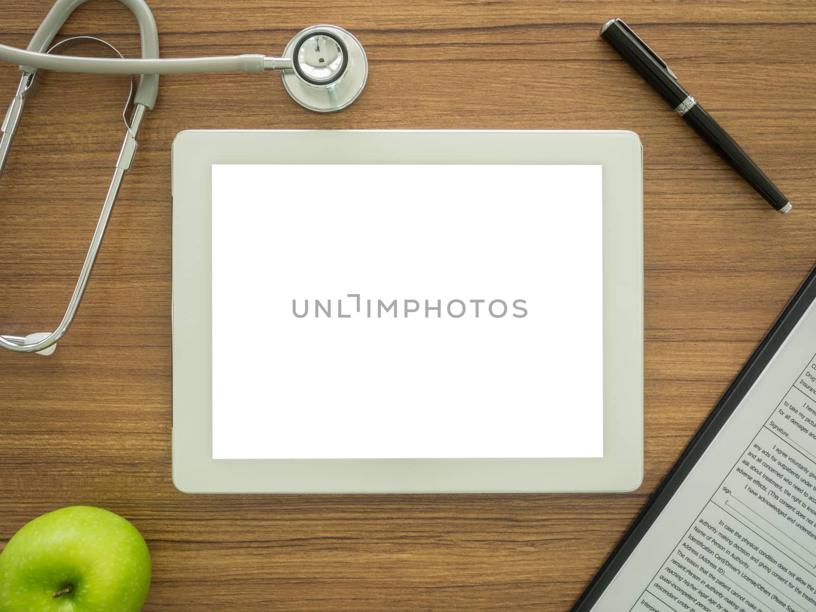 free space for text in tablet computer on desk's doctor. top view