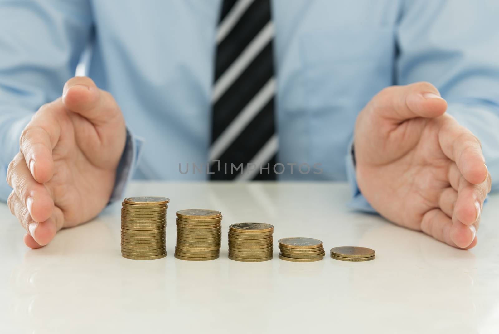 Businessman hands protecting the money. finance concept.