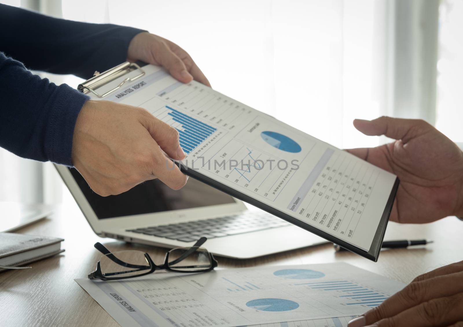 Financial analysts provide summary reports to manager.