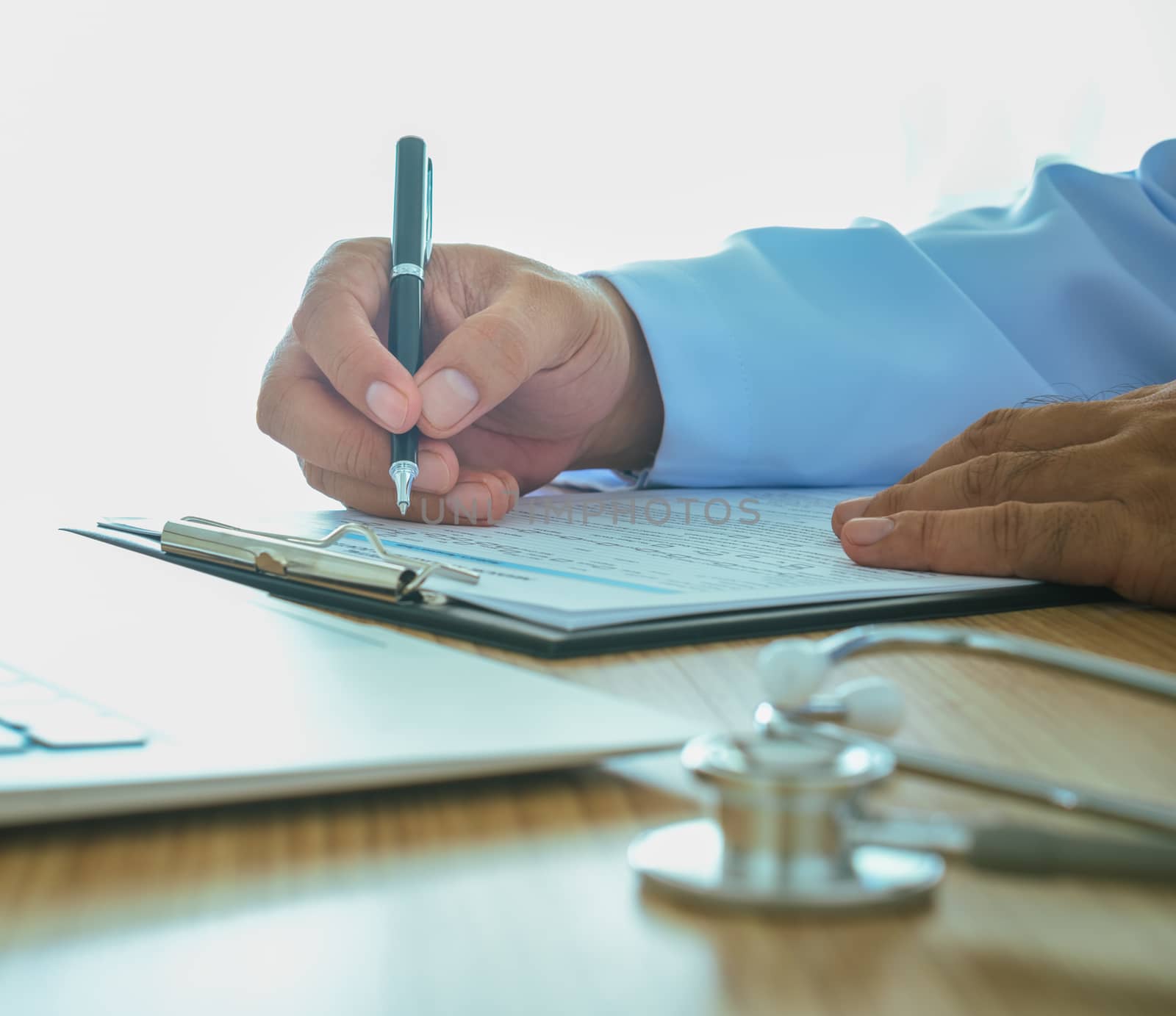 Doctors are recording information the patient's illness.