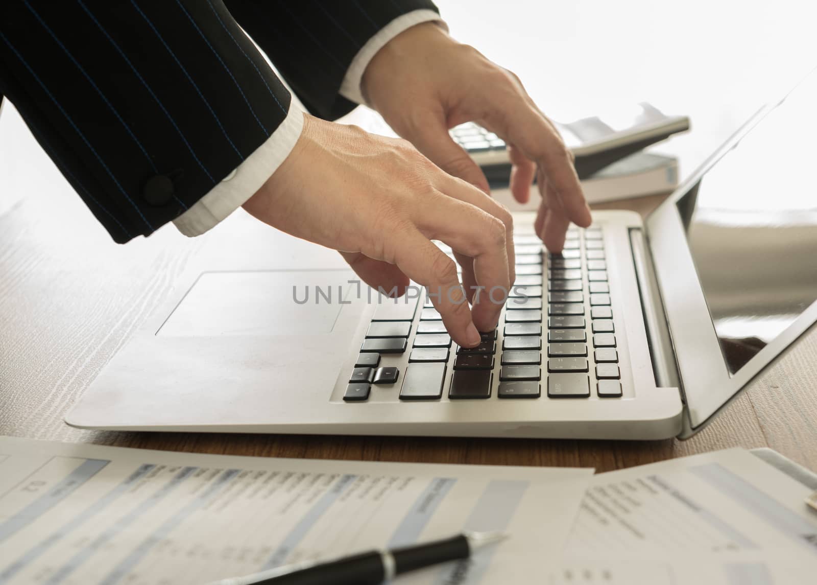 Accountants are saving the data into the computer.