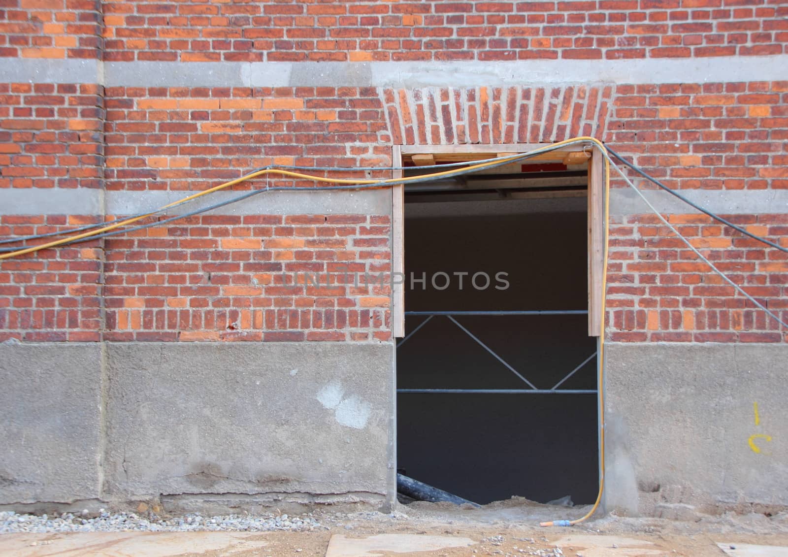 Empty Door Opening with Wires and Materials at Building Site