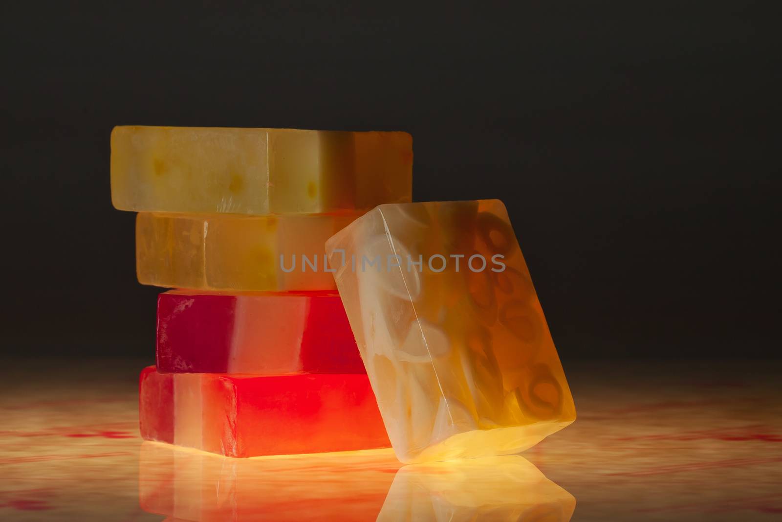 close up view of color soap on black back