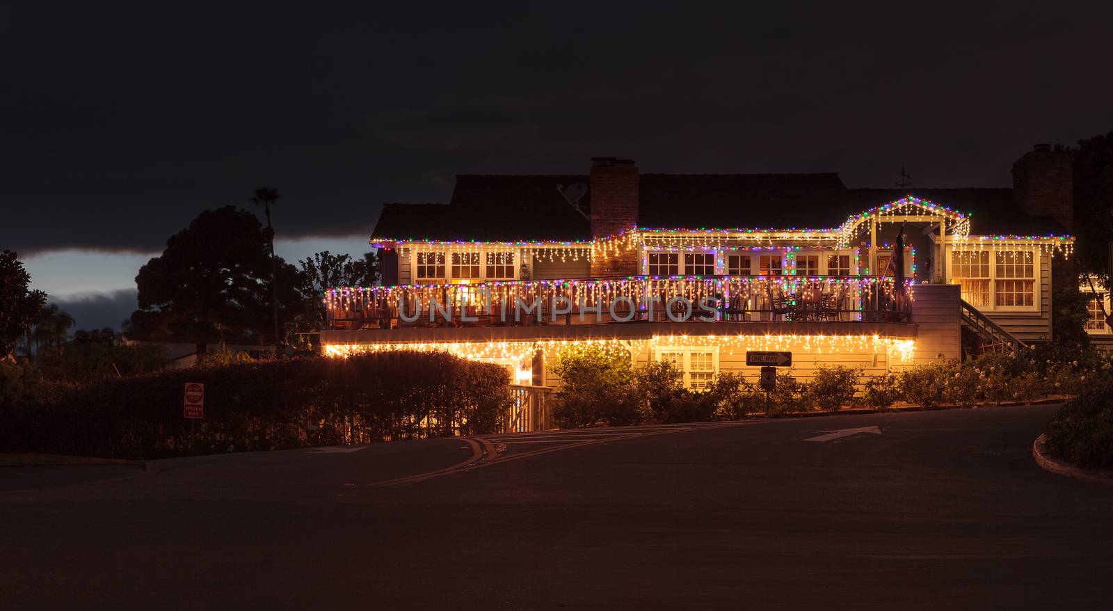 Christmas lights on a cottage on Southern California near the beach.