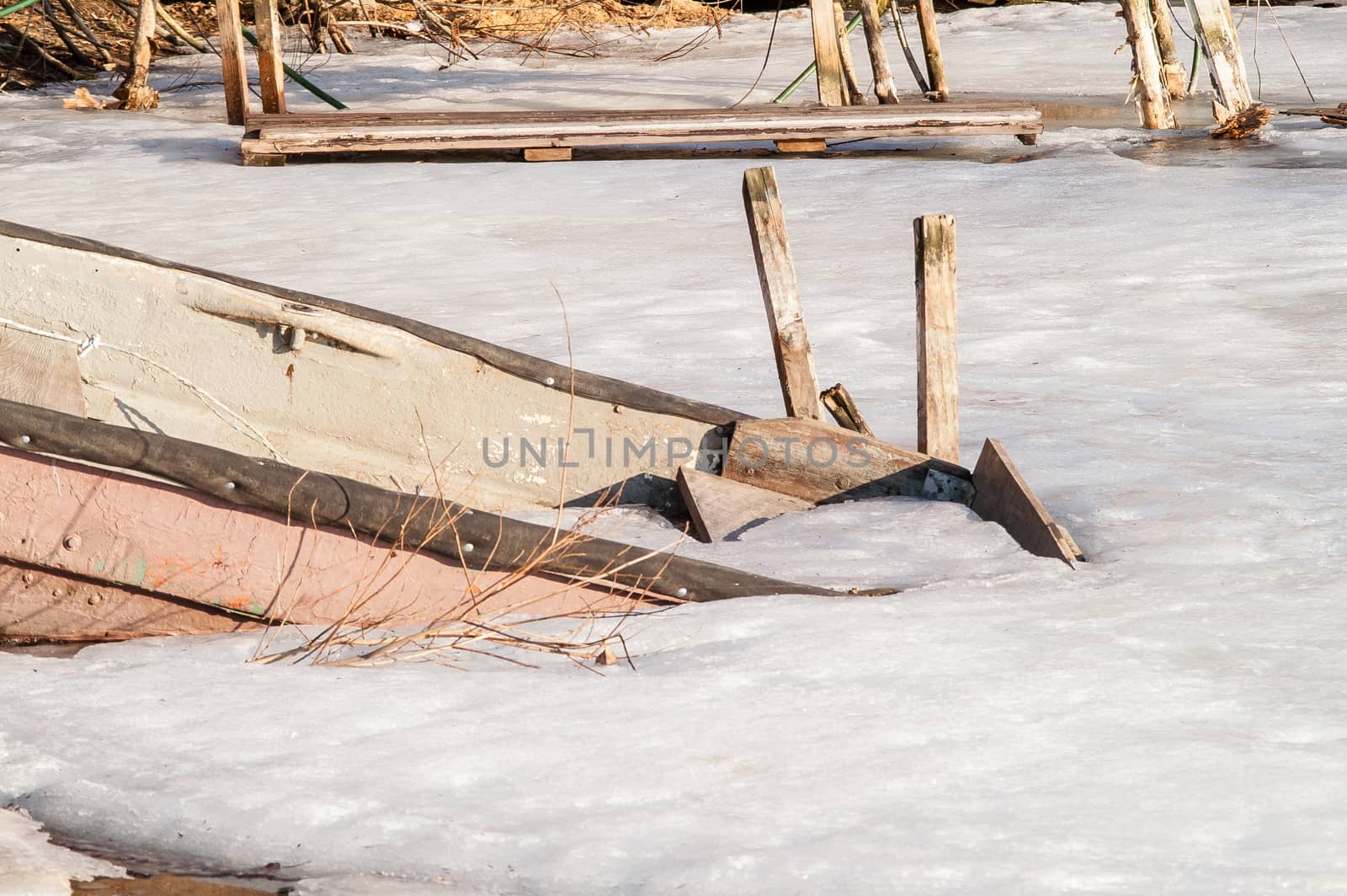 icebound old boat in the river during the day