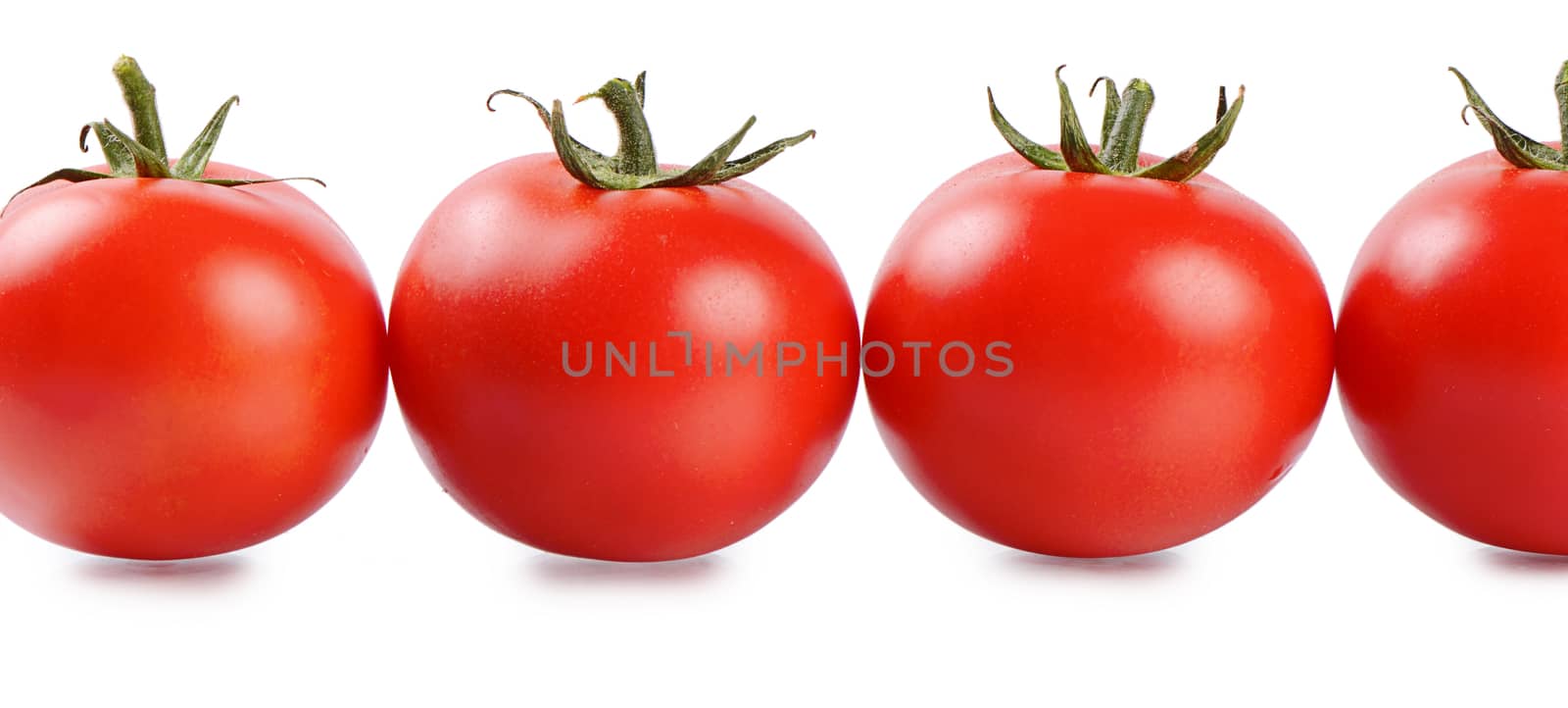 Red fresh tomatoes isolated on white background