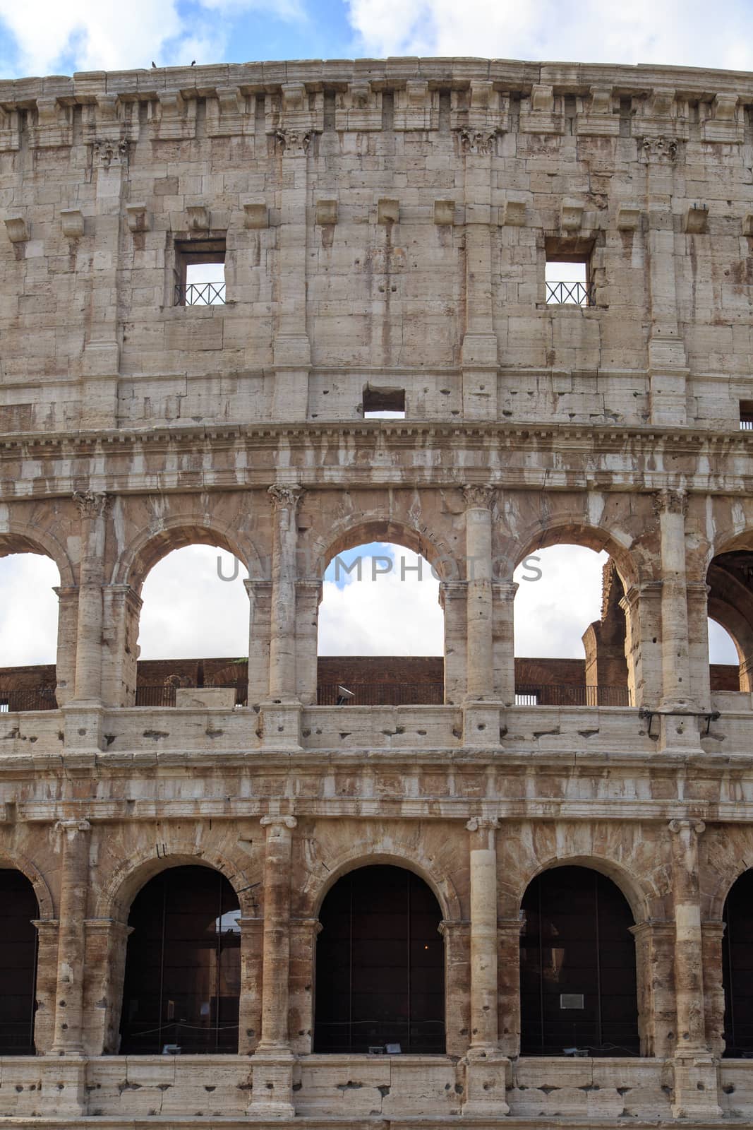 Close up detailed view of ancient amphitheatre of Colosseum built by Vespasian and Titus in Rome.