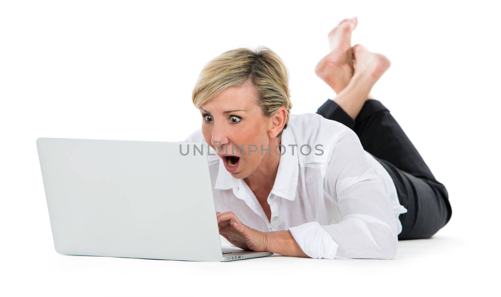 woman manager sat on the floor with laptop by Flareimage