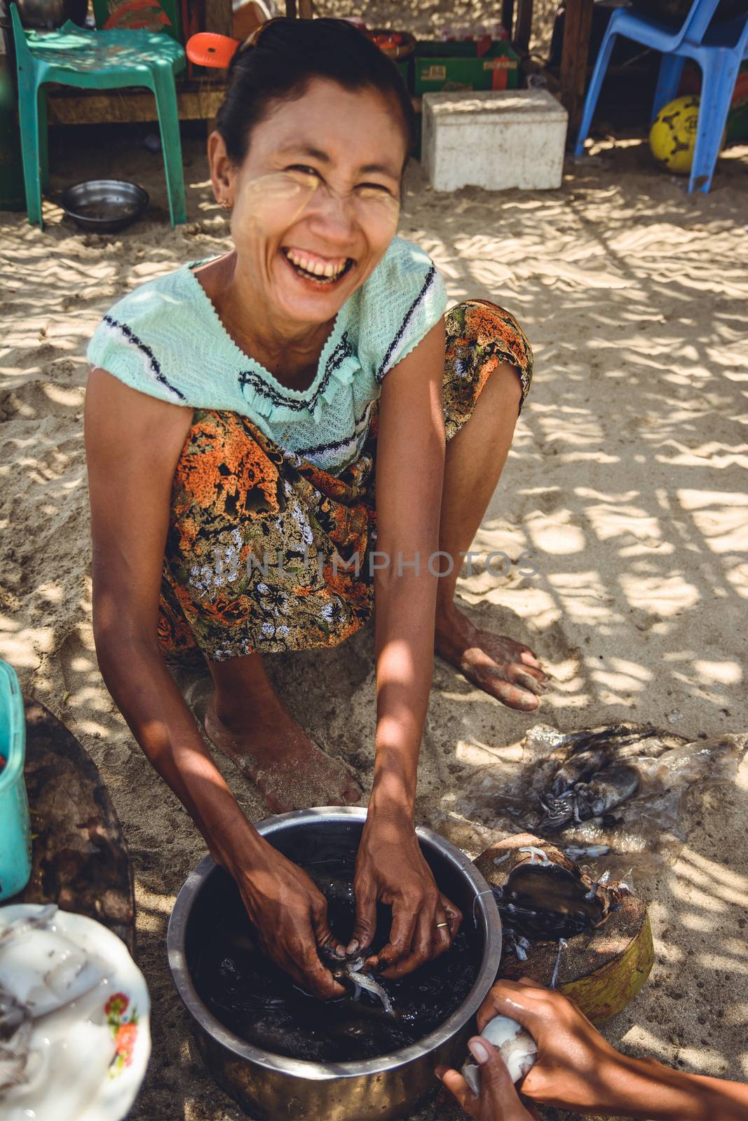 A Myanmar Woman Preparing Squid by kargoo