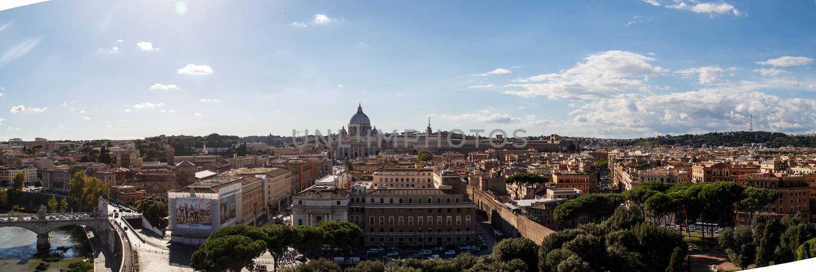 ROME, ITALY - SEPTEMBER 25, 2015 : Top view of historical city of Rome with domes, on cloudy blue sky background.