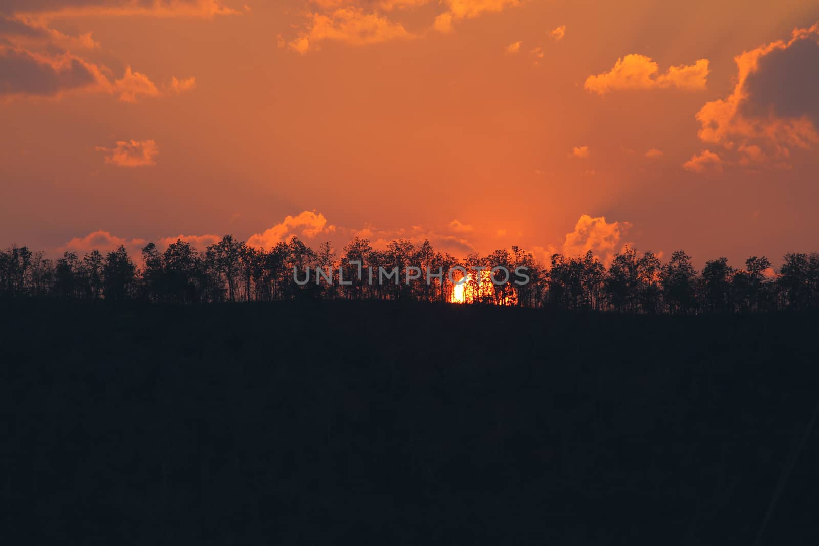 orange sunset on mountain in thailand