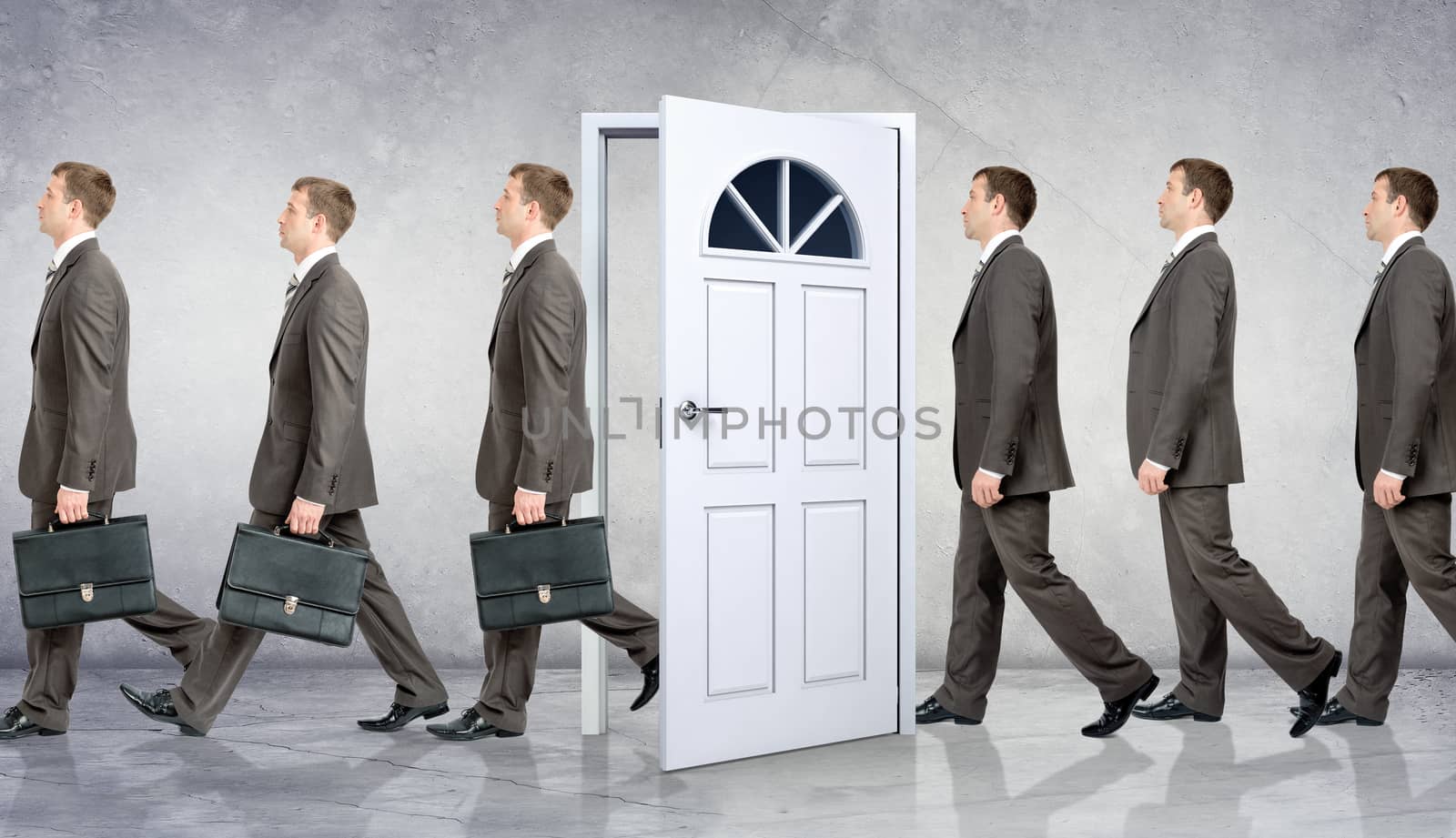 Line of businessmen going through door by cherezoff