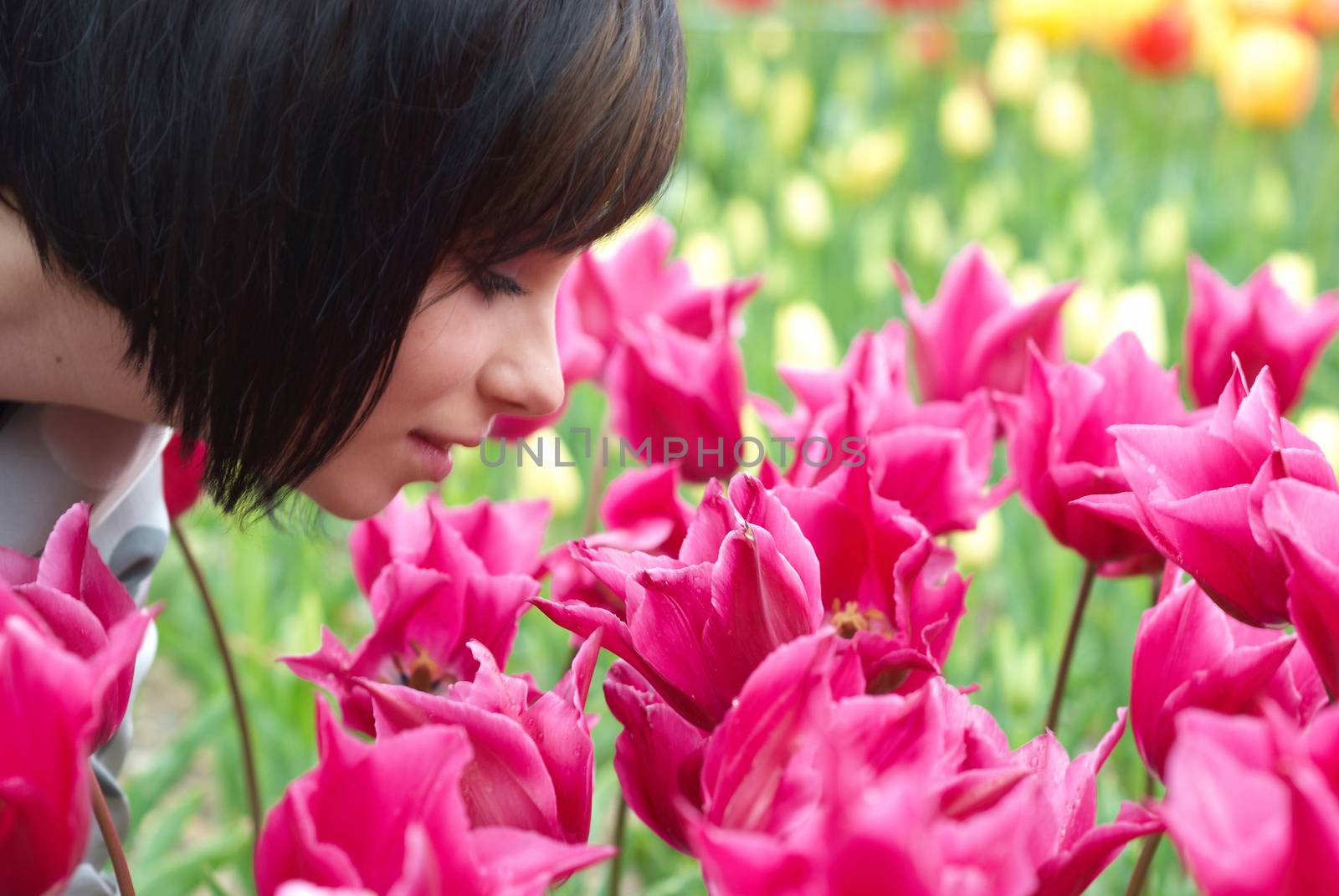 Pretty girl with tulips with soft background