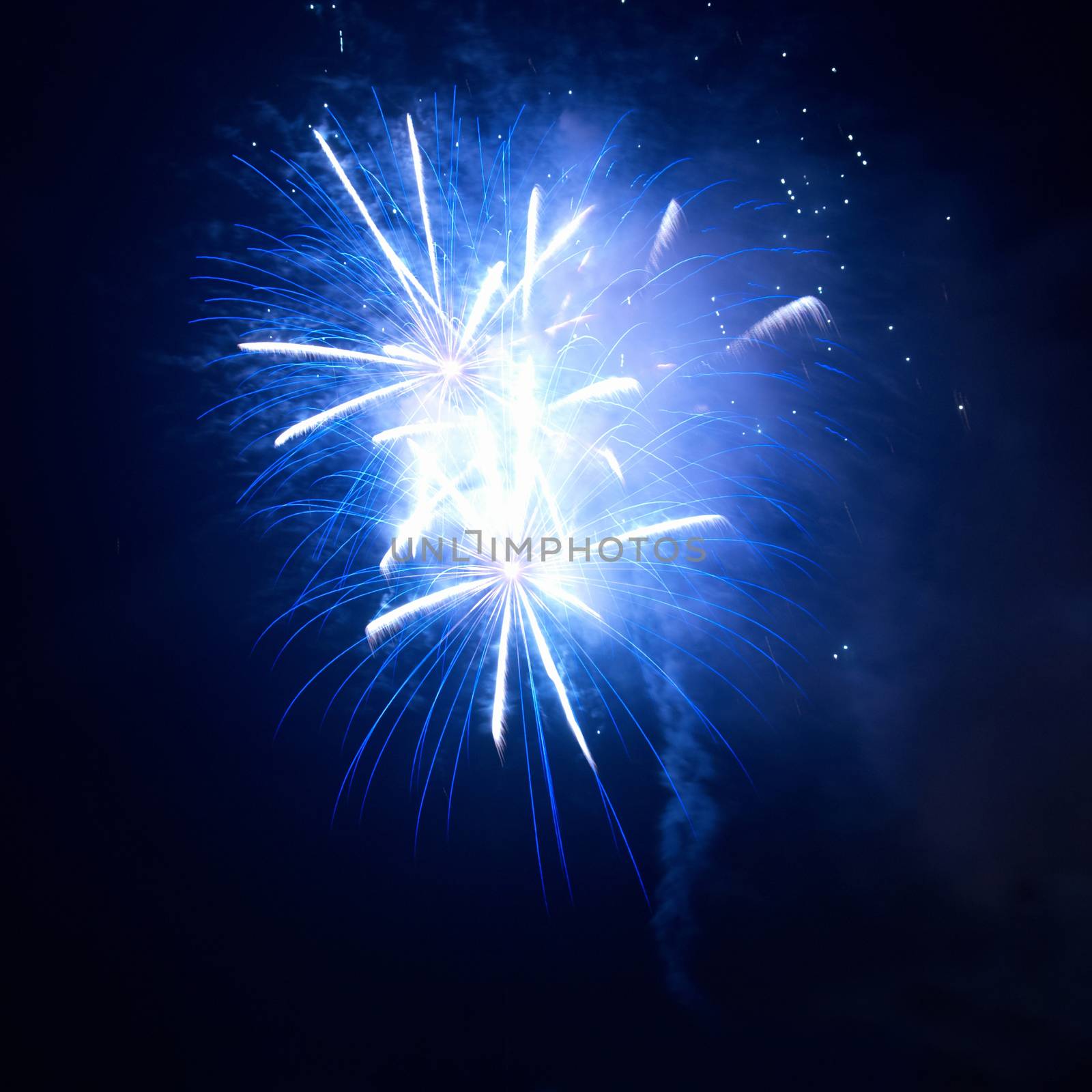 Blue fireworks on the black sky background