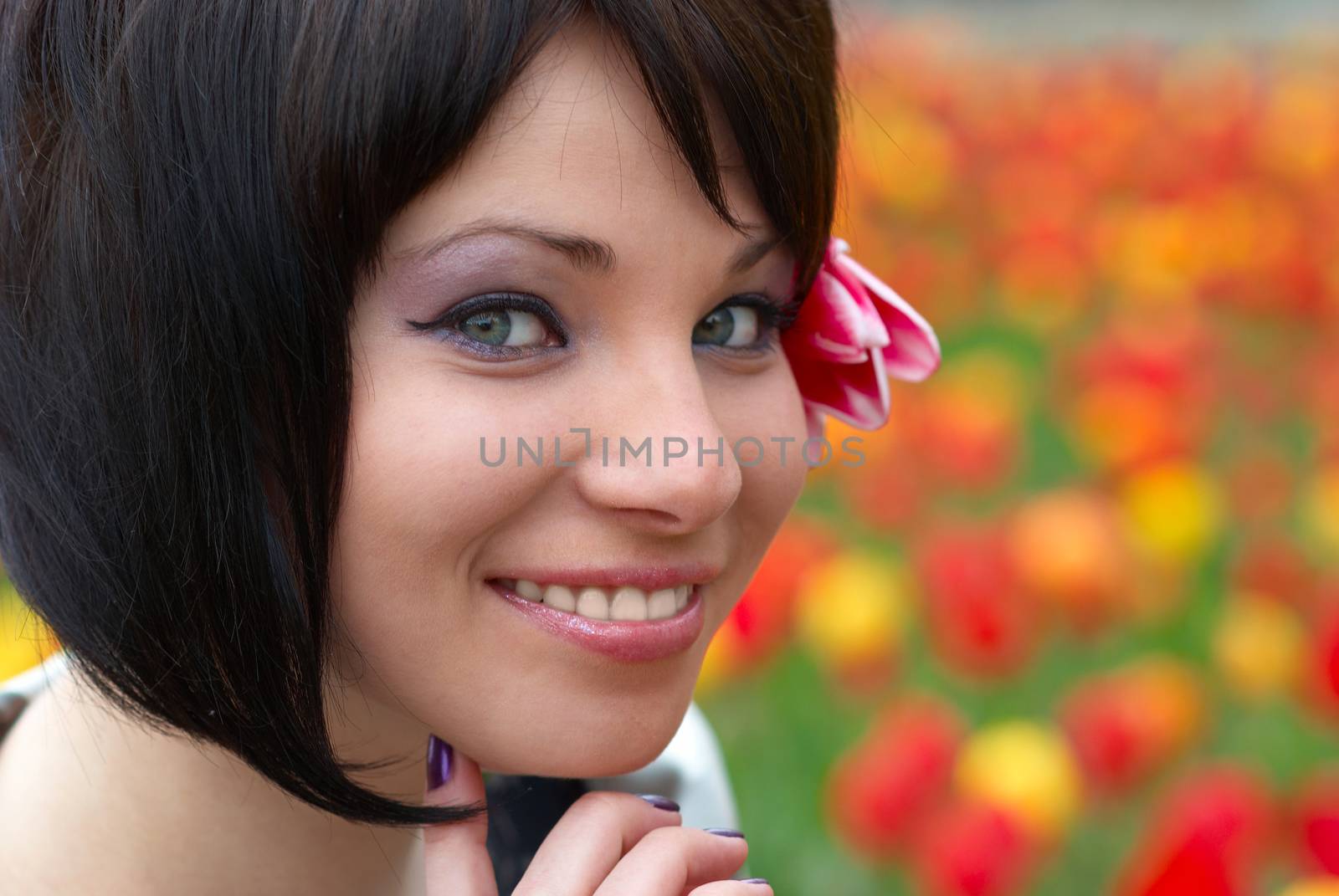 Pretty girl with tulips with soft background