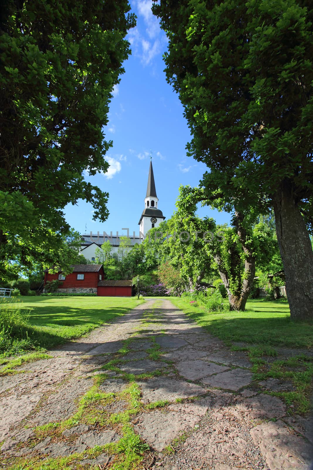 Summer view on Mariefred Church and garden