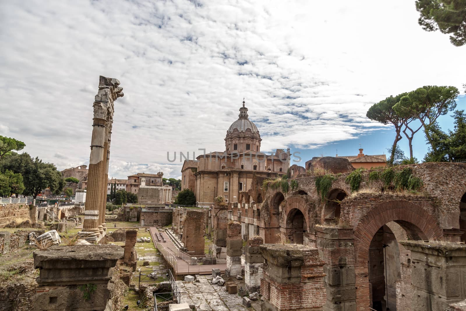 ROME, ITALY - SEPTEMBER 26, 2015 : View of ancient Roman Forum in Rome, on cloudy blue sky background.