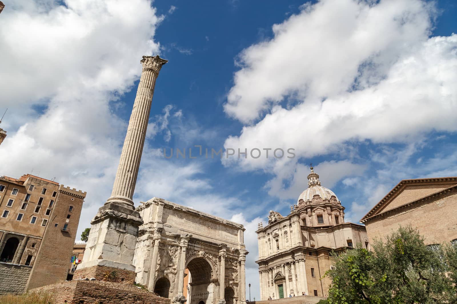 ROME, ITALY - SEPTEMBER 24, 2015 : View of ancient Roman Forum in Rome, on cloudy blue sky background.