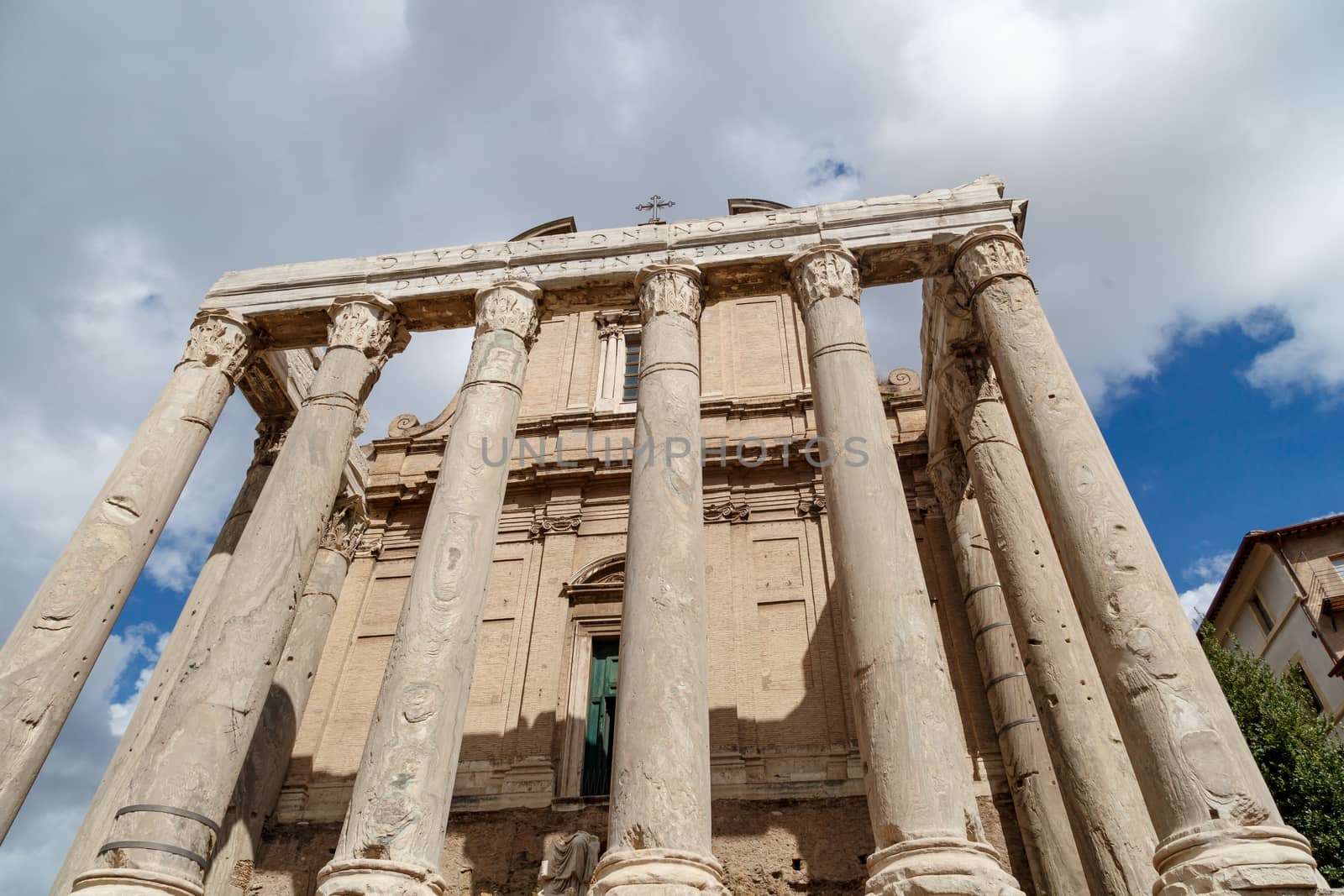 View of the ancient church at Roman Forum, on cloudy blue sky background.