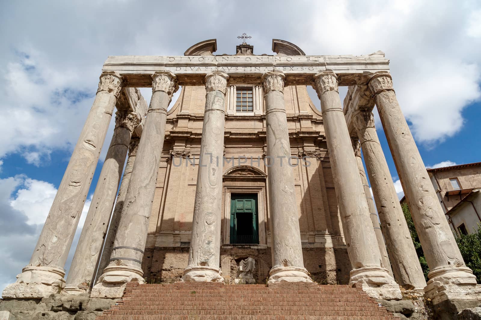 View of the ancient church at Roman Forum, on cloudy blue sky background.