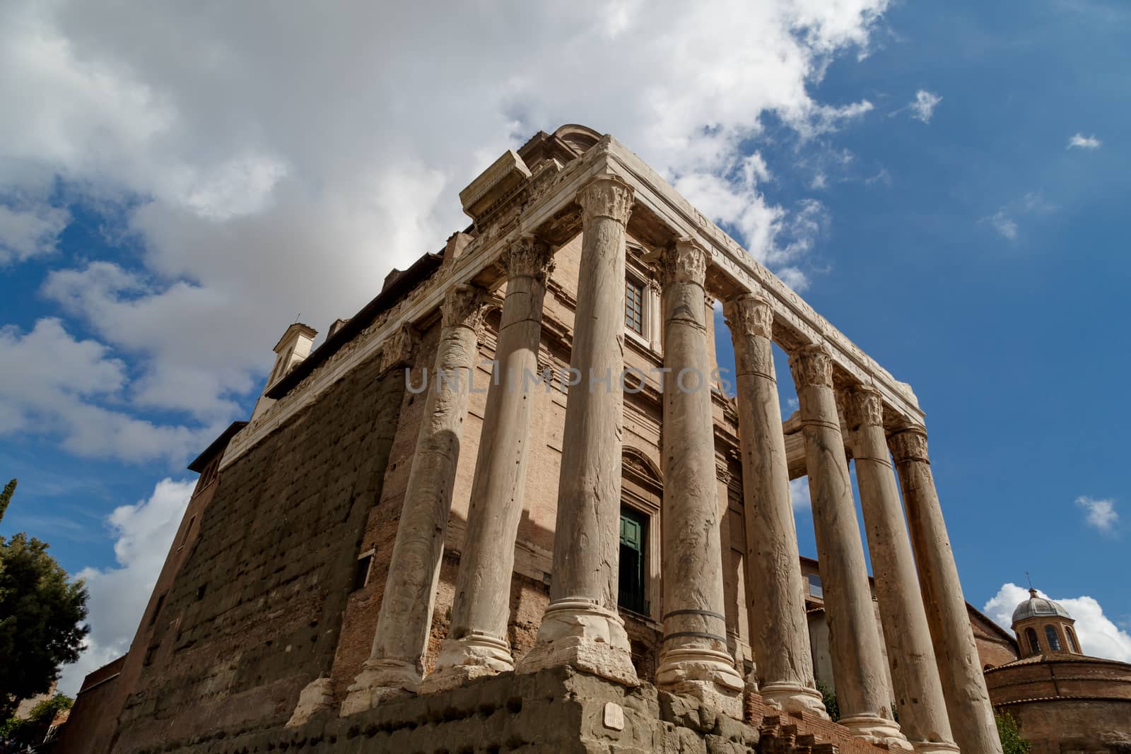 View of the ancient church at Roman Forum, on cloudy blue sky background.