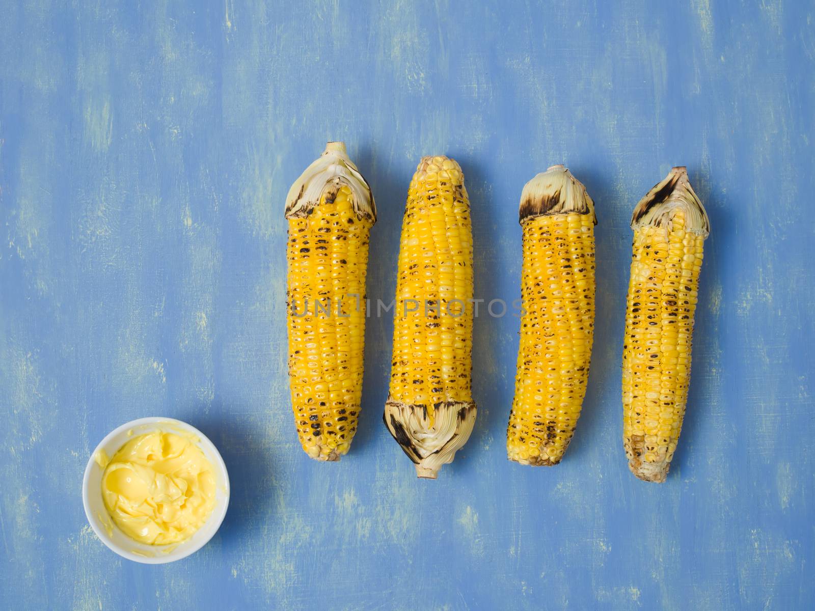 close up of rustic grilled golden corn cob