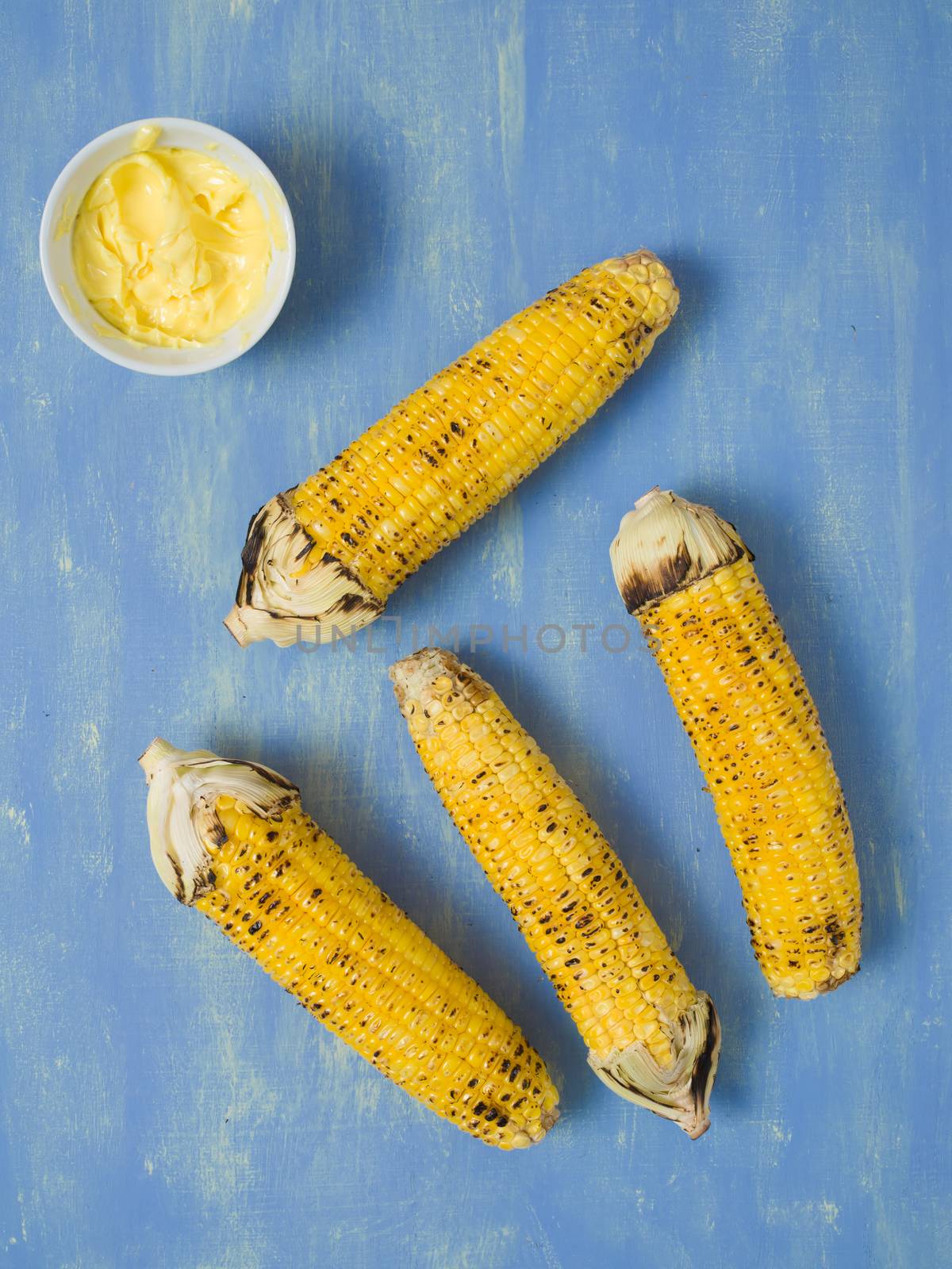 close up of rustic grilled golden corn cob