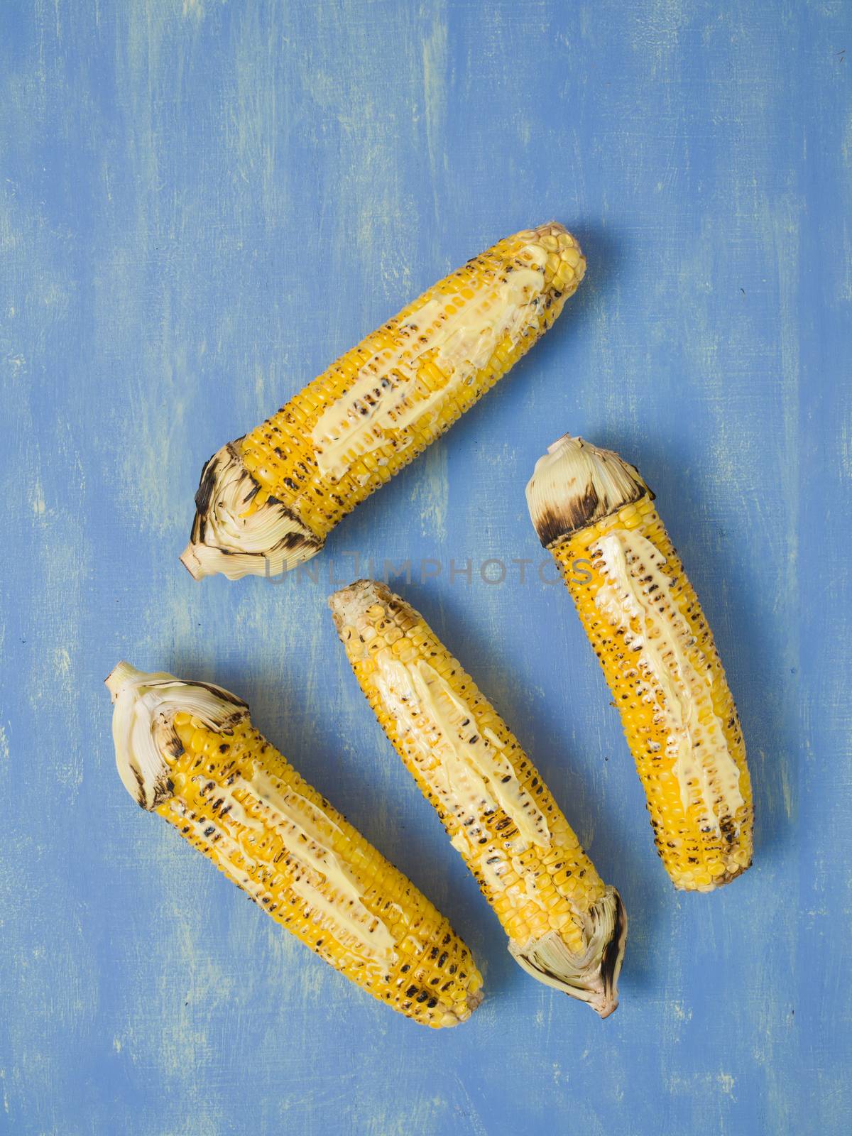 close up of rustic grilled golden corn cob