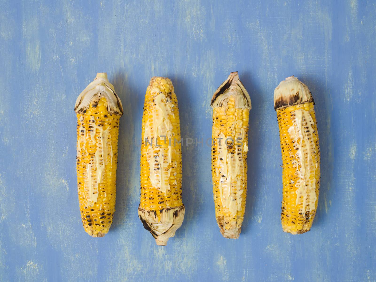 close up of rustic grilled golden corn cob