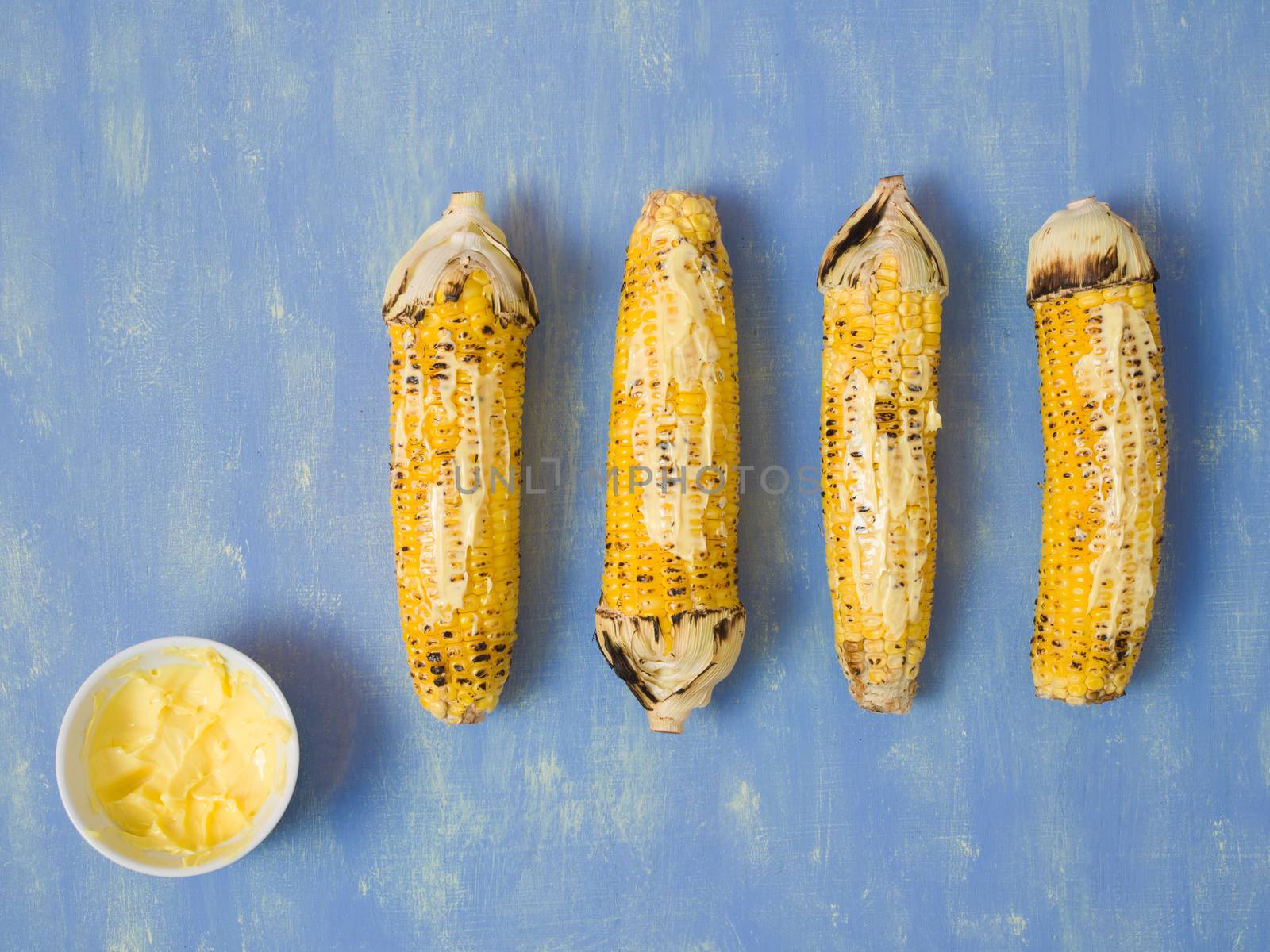 close up of rustic grilled golden corn cob
