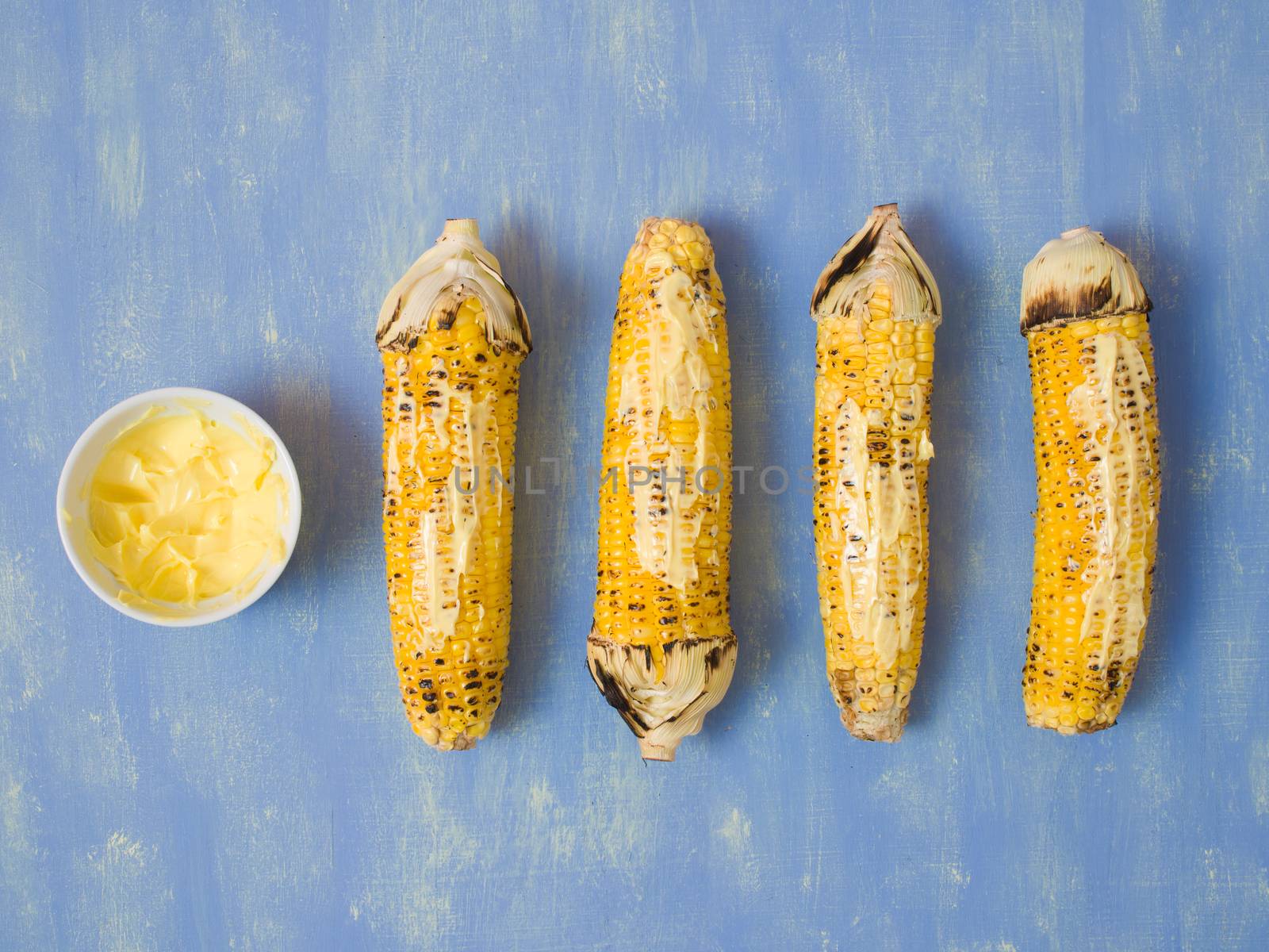 close up of rustic grilled golden corn cob