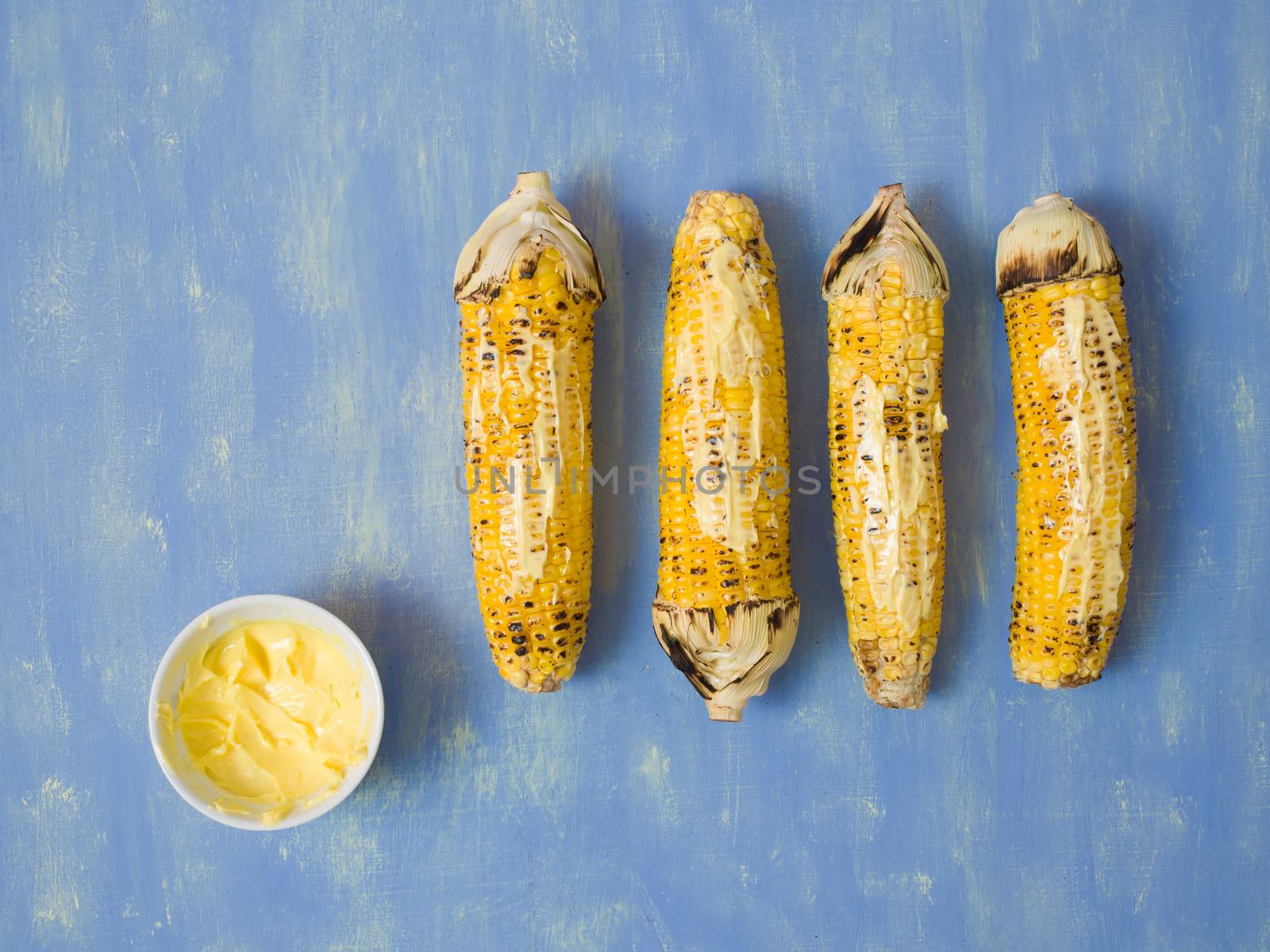 close up of rustic grilled golden corn cob