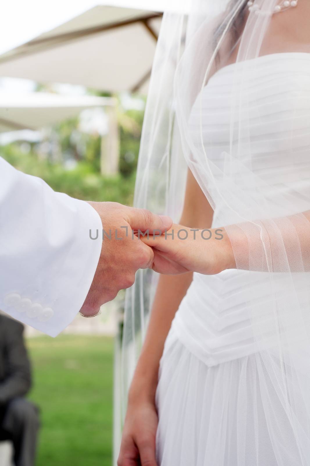 close up view of humans hands wedding