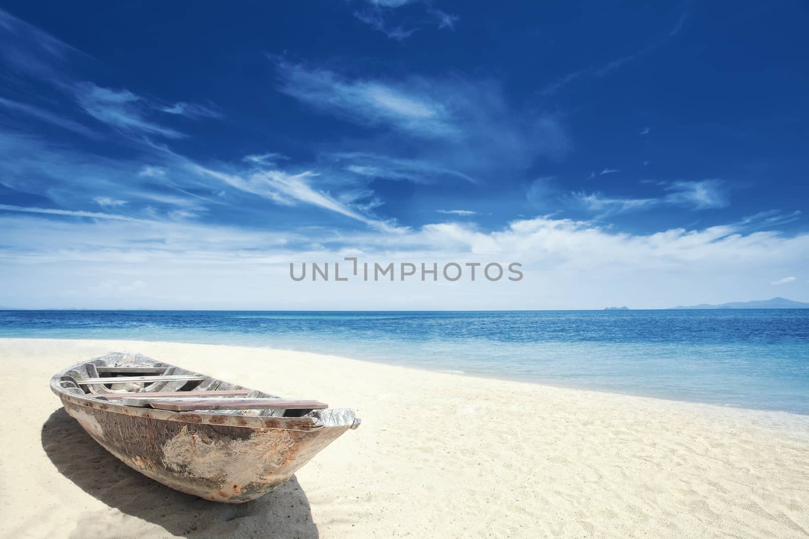 View of nice tropical  beach  with old boat