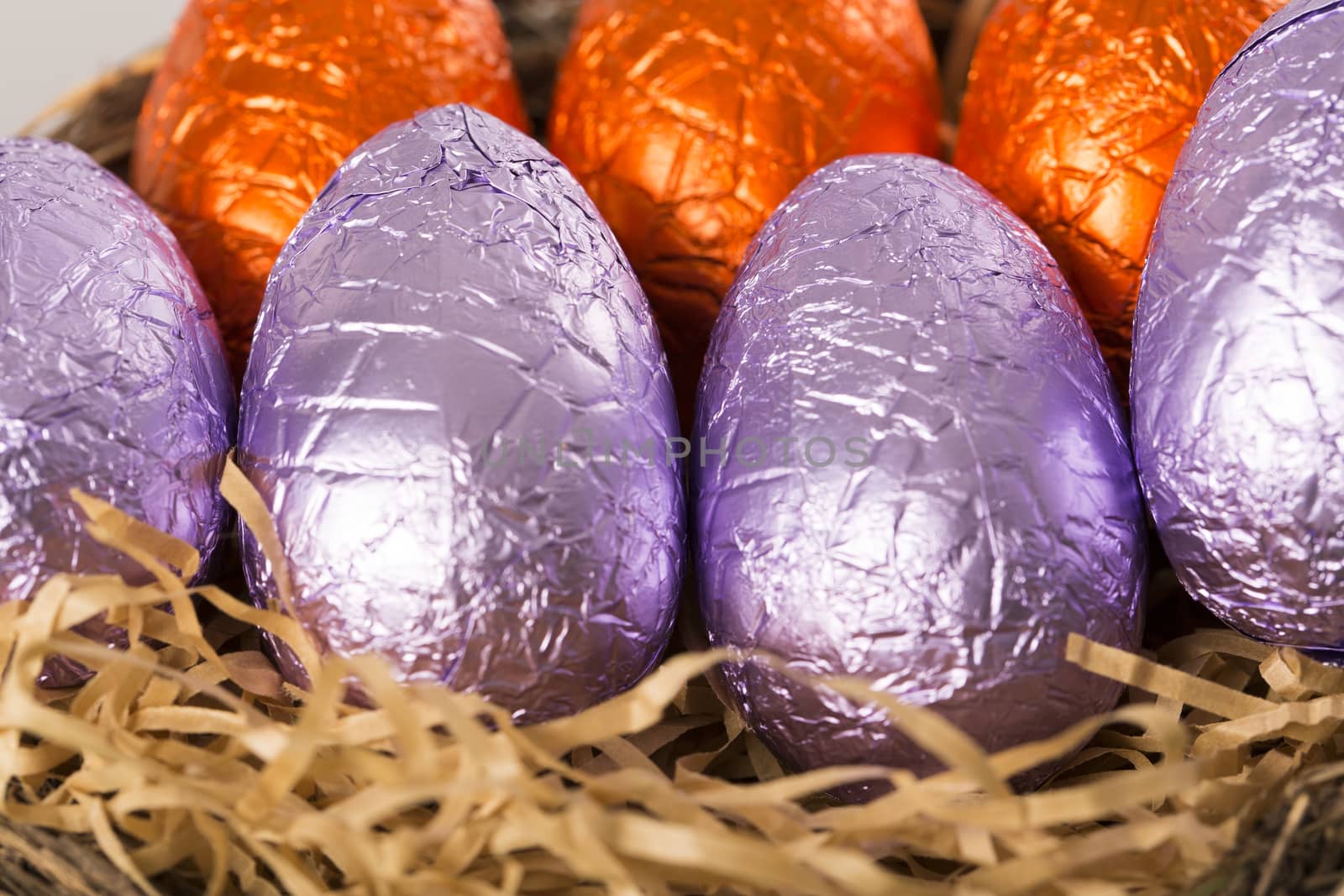 Group of colorful candy Easter eggs wrapped in foil 