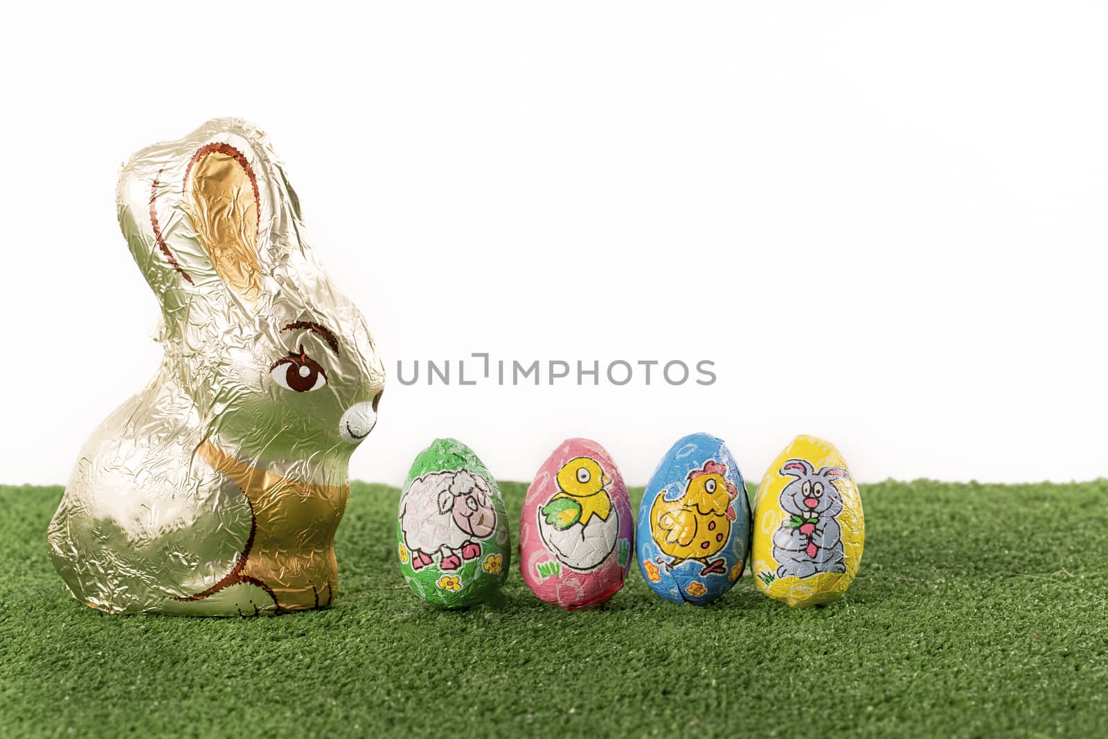 Group of colorful candy Easter eggs wrapped in foil 