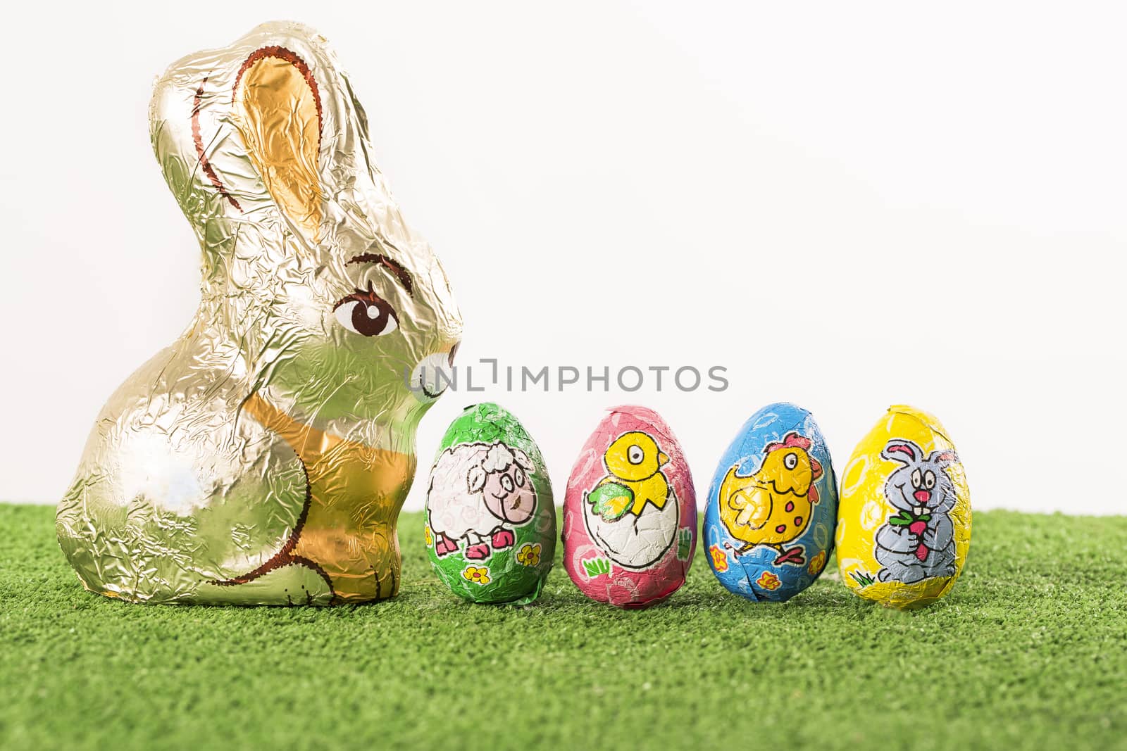 Group of colorful candy Easter eggs wrapped in foil 