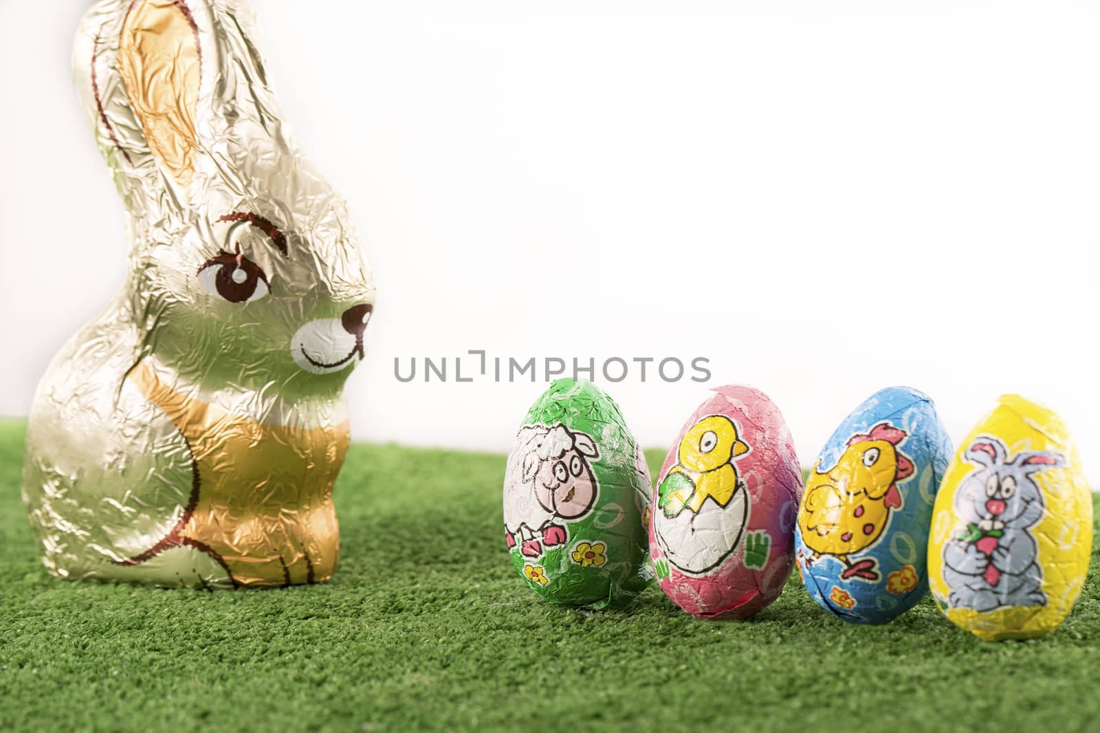 Group of colorful candy Easter eggs wrapped in foil 