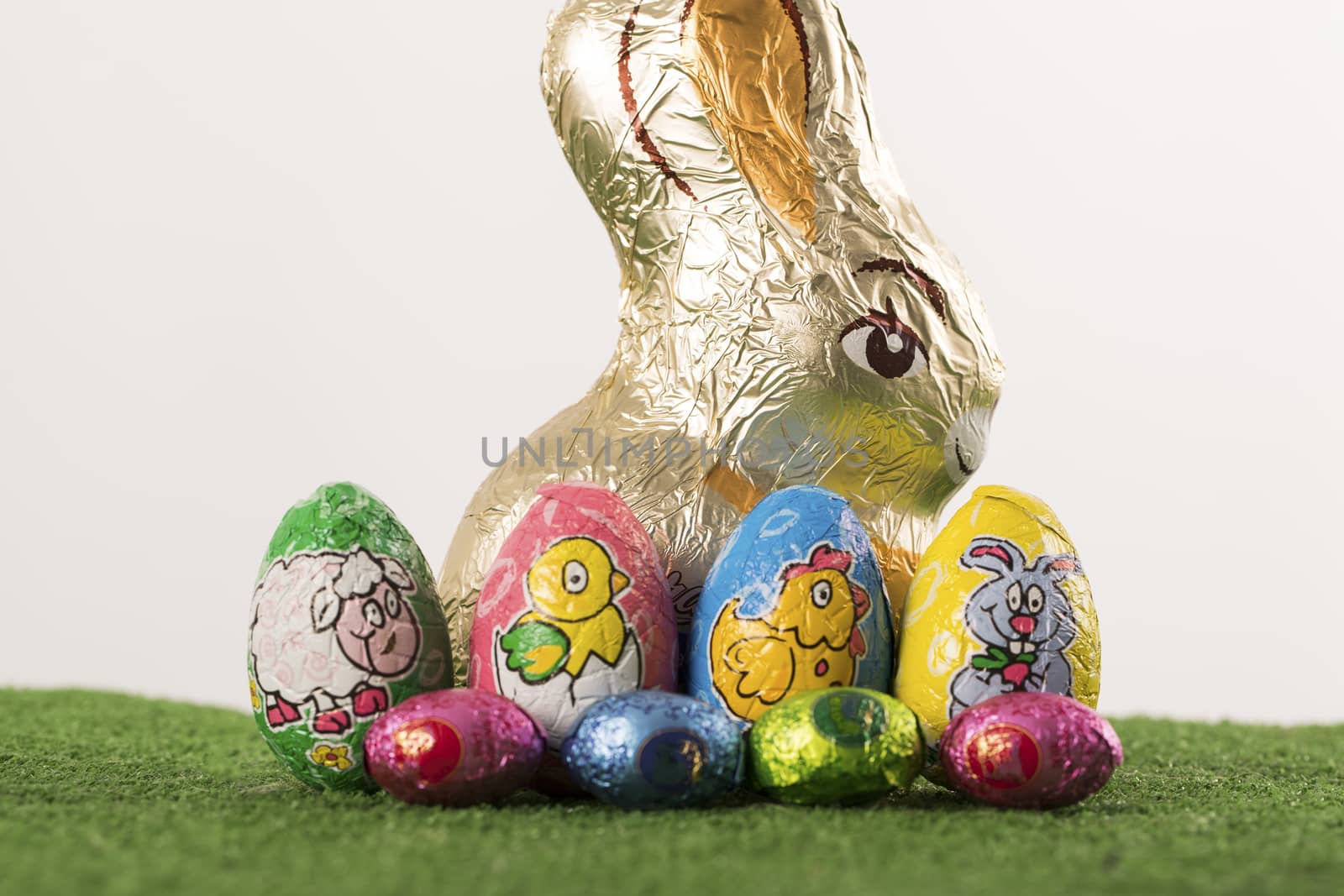 Group of colorful candy Easter eggs wrapped in foil 