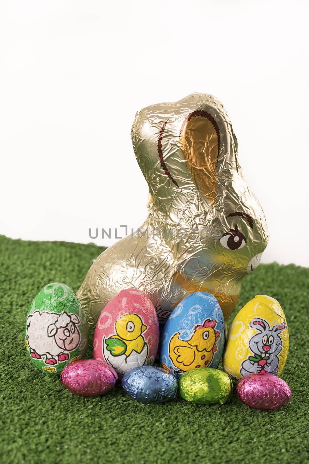 Group of colorful candy Easter eggs wrapped in foil 