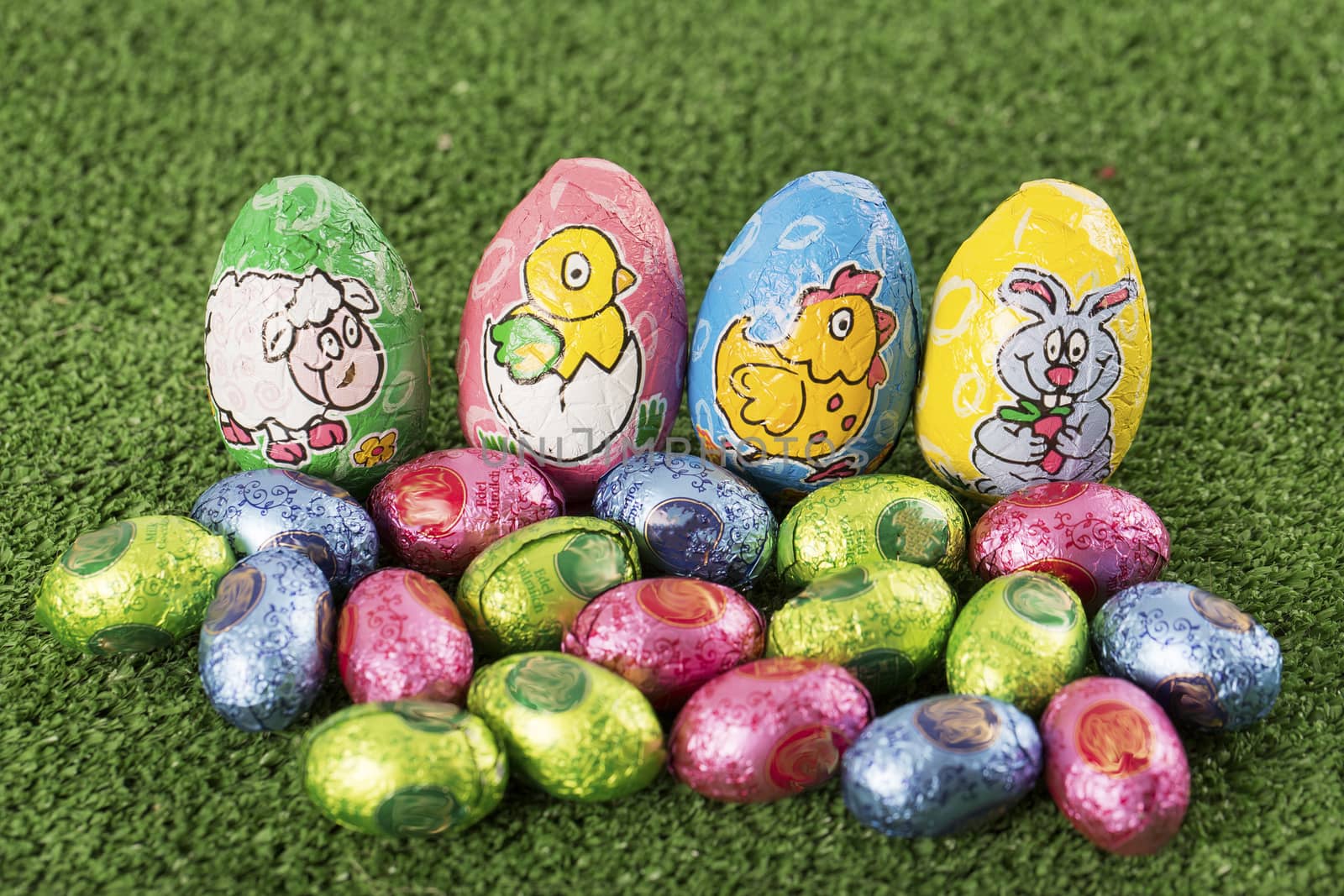 Group of colorful candy Easter eggs wrapped in foil 